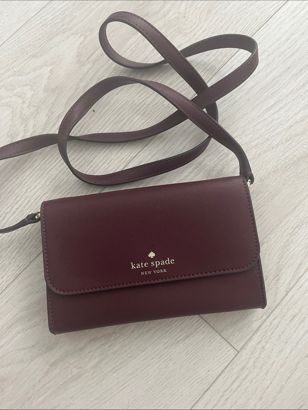 kate spade Burgundy Saffiano Crossbody Wallet with Gold Logo